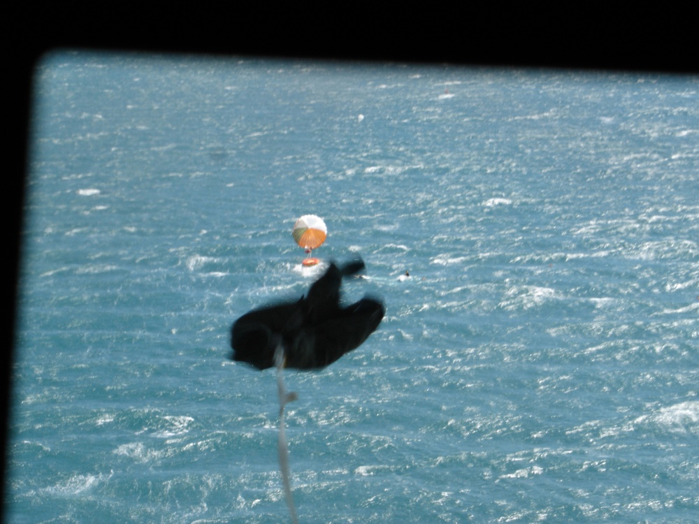 C-130 DROPPING LIFE RAFT