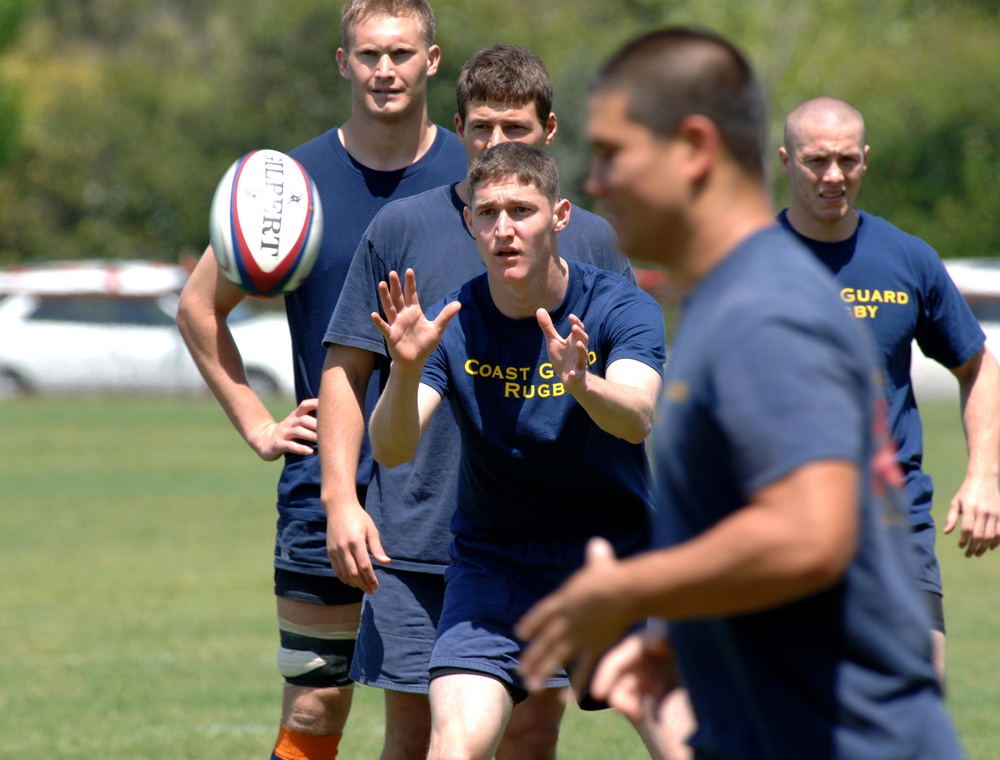RUGBY PLAYERS RUN UPFIELD