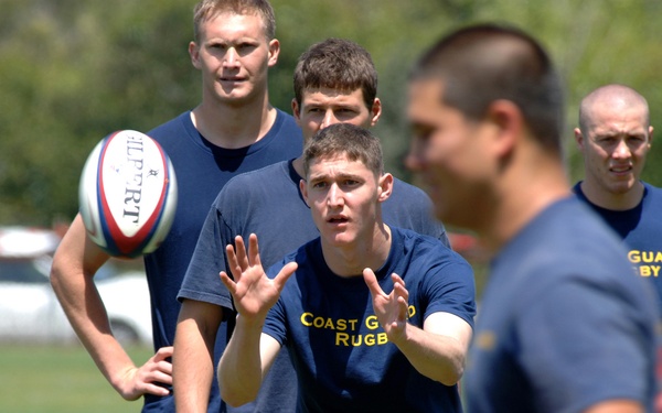 RUGBY PLAYERS RUN UPFIELD