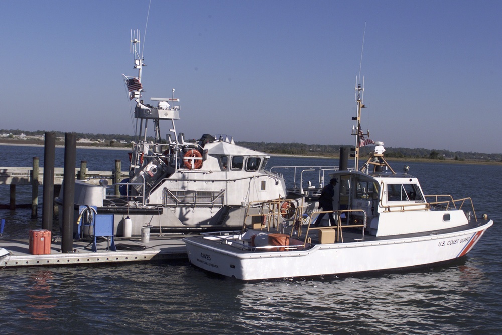 47-foot motor lifeboat and 41-foot utility boat moored at the pier