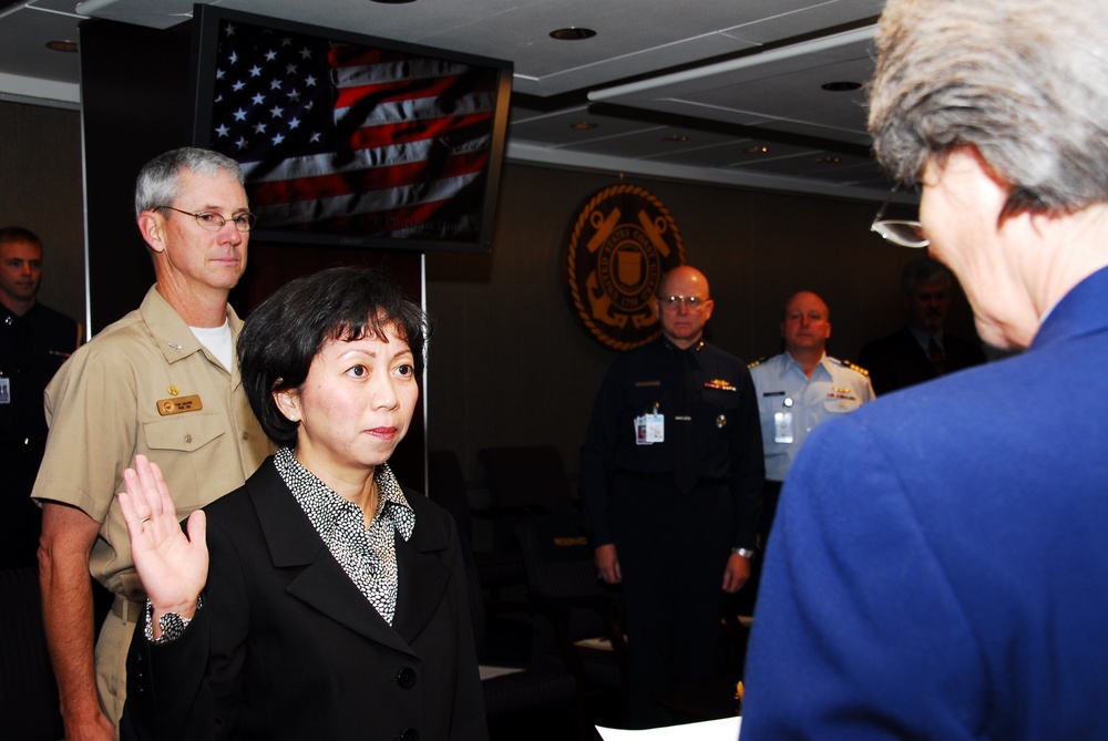 Ms. Giao L. Phan is sworn in as the Coast Guard Deputy Director of Aquisition