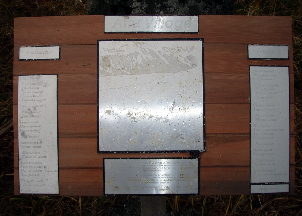 COAST GUARDSMEN REPAIR PLAQUE, REMEMBER THOSE WHO CAME BEFORE ON ATTU