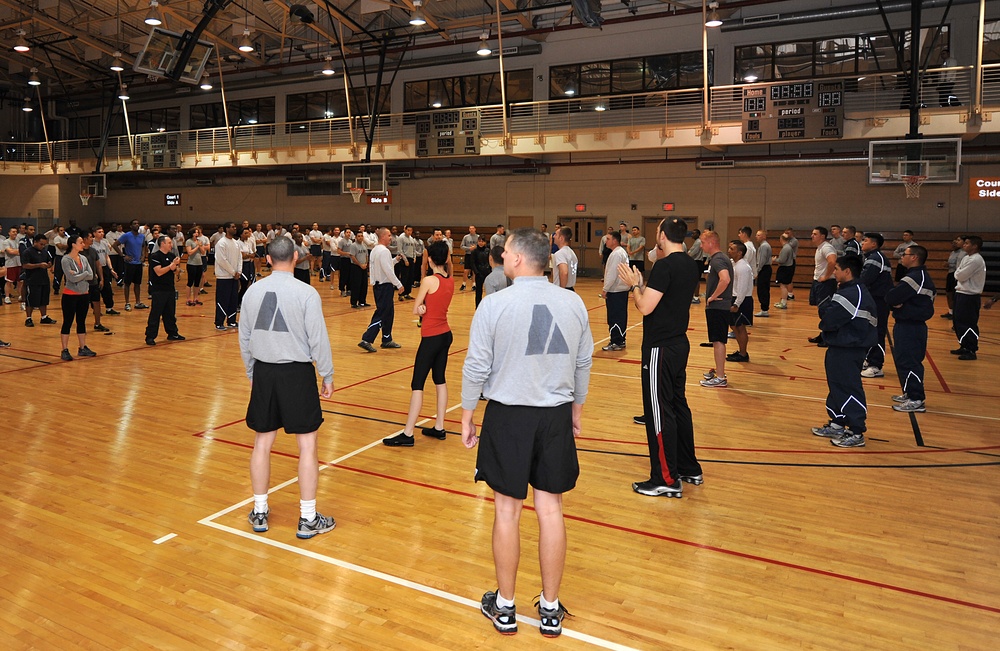 Fitness fiends pack basketball court for P90X workout