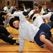 Fitness fiends pack basketball court for P90X workout