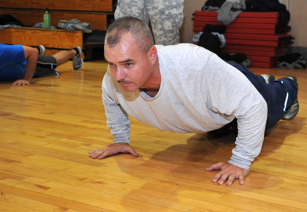 Fitness fiends pack basketball court for P90X workout