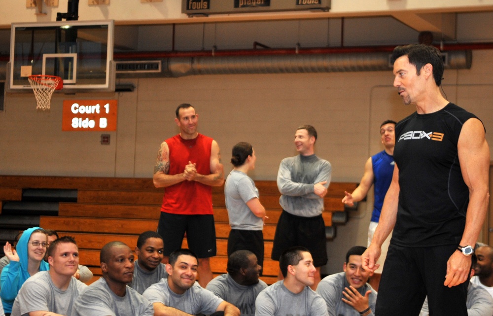 Fitness fiends pack basketball court for P90X workout