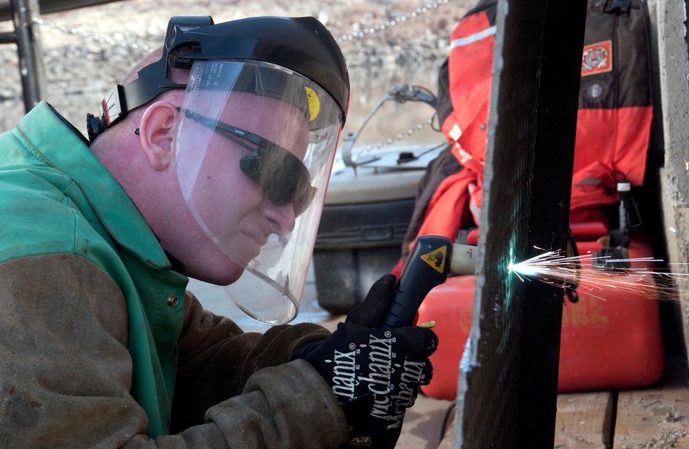 Kanawha crewmember repairing the deck