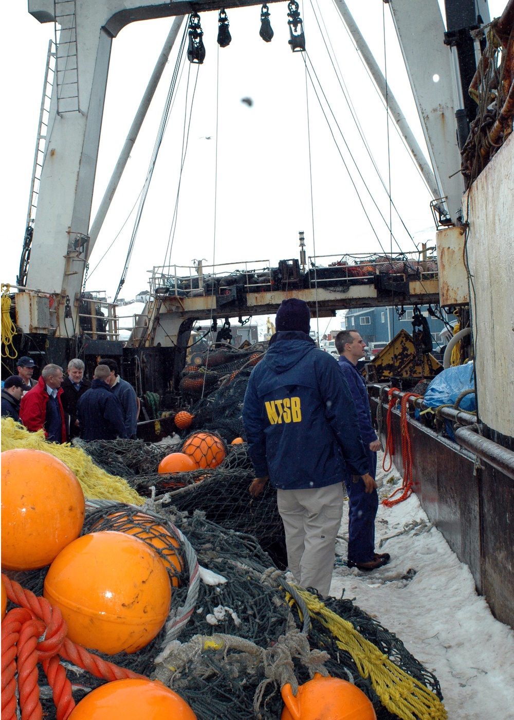 LIAM LARUE, CMDR. JOHN NADEAU EXAMINE TRAWL DECK OF ALASKA WARRIOR