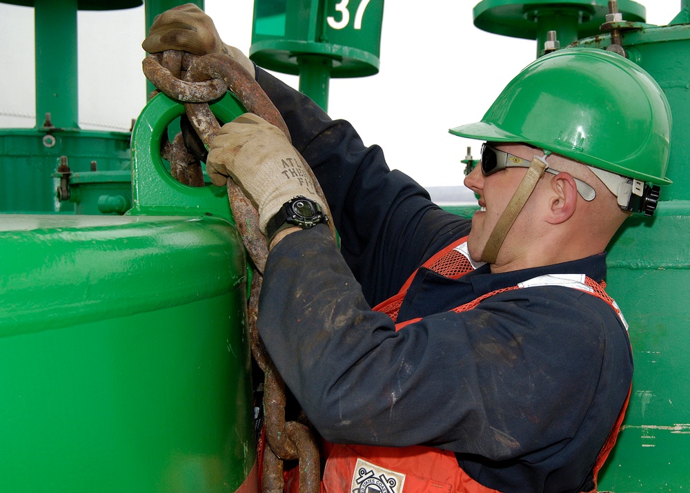 CGC Buckthorn crewman preparing buoy