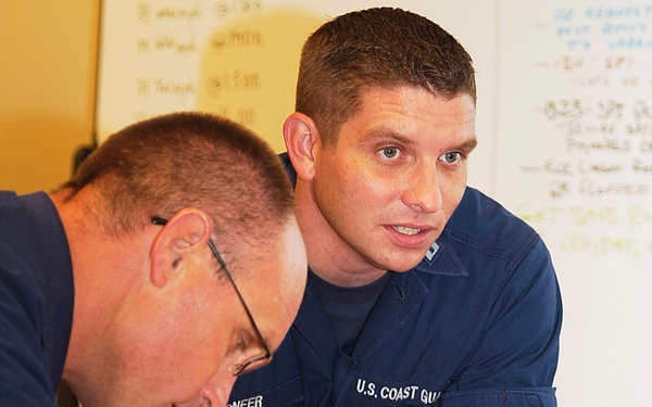 Members of the IMT prepare a brief during response to Hurricane Dolly