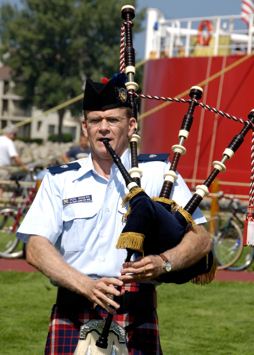 COAST GUARD BAGPIPE BAND MEMBER PLAYS DURING SERVICE