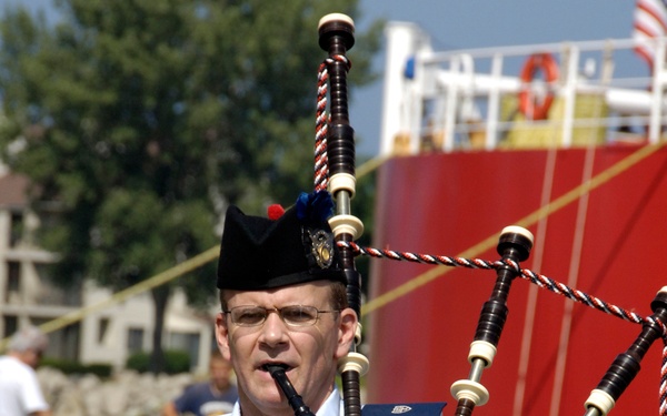 COAST GUARD BAGPIPE BAND MEMBER PLAYS DURING SERVICE