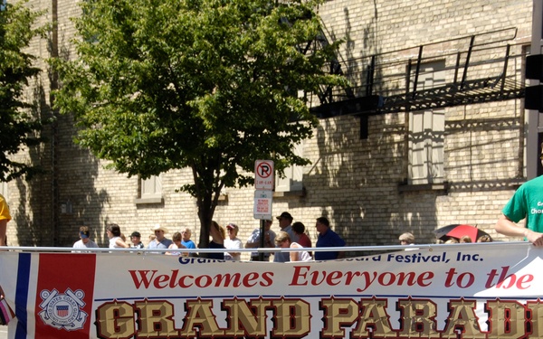 OFFICIAL GRAND HAVEN COAST GUARD FESTIVAL BANNER STARTS PARADE