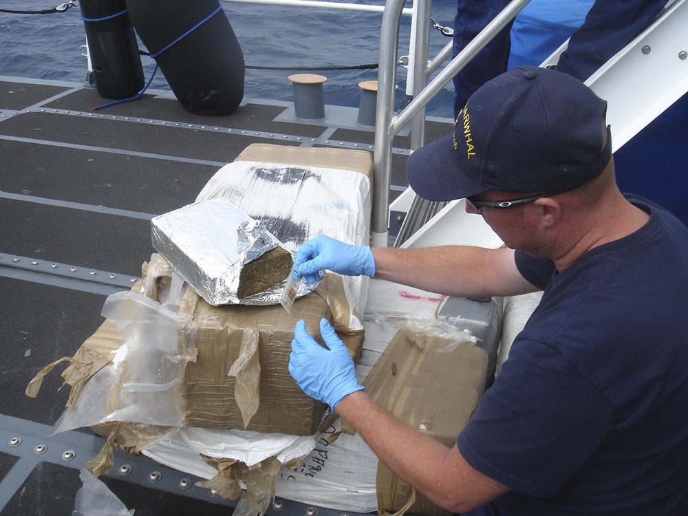 Coast Guard Cutter Narwhal chemically tests a bale of marijuana