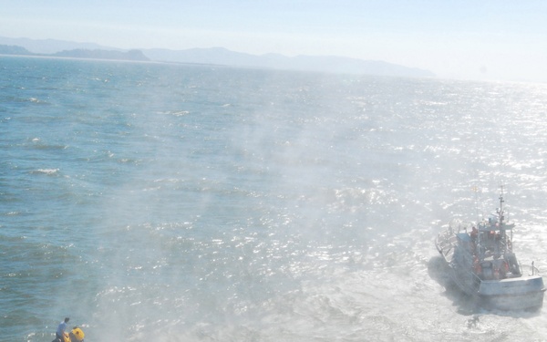 Men rescued off capsized vessel