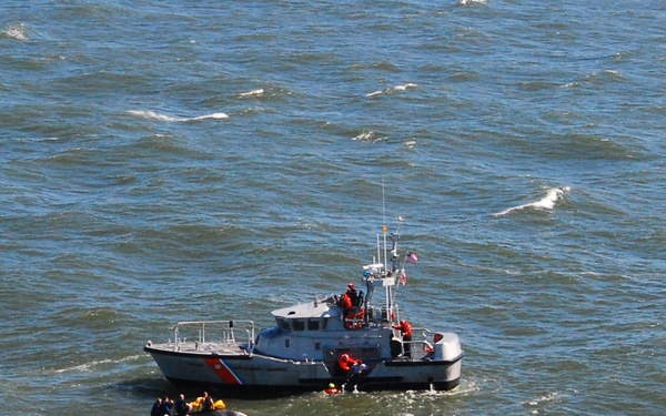 Men rescued off capsized vessel