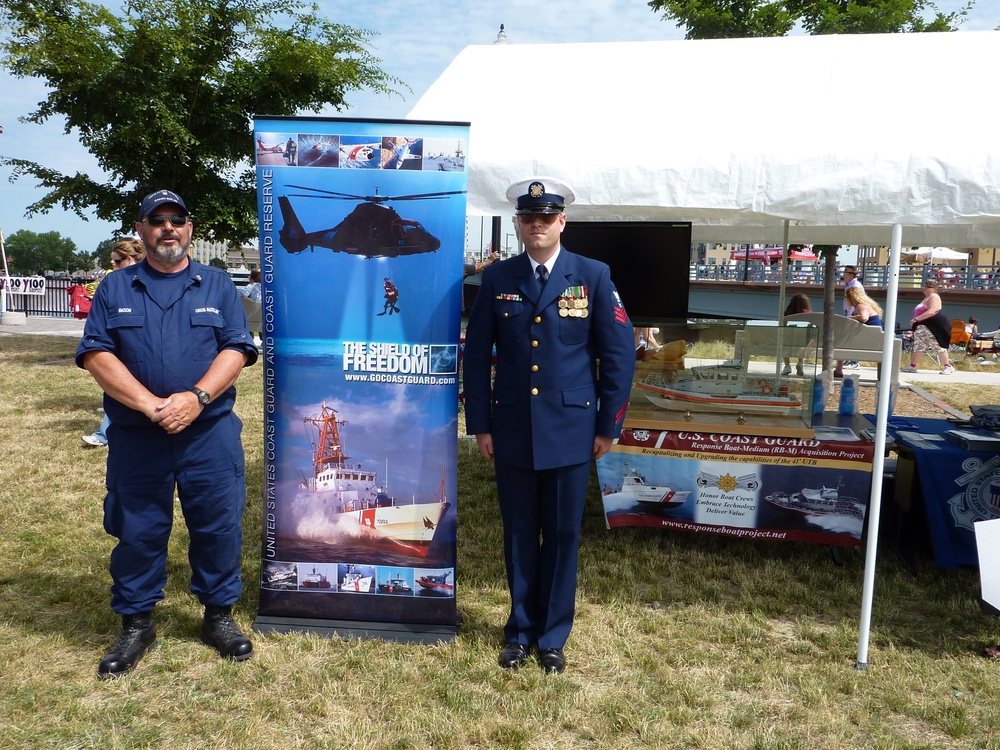 Green Bay, Wisc. - Coast Guard Recruiter YN1 Hendrickson and Auxiliary Member promote the Coast Guard