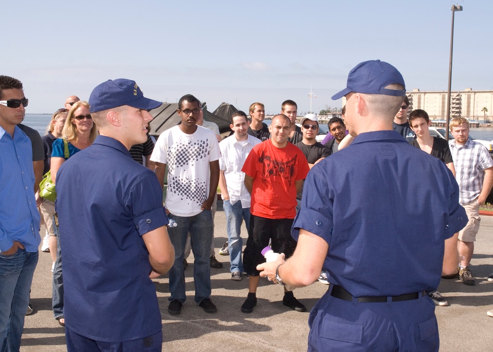 Graduates of Coast Guard basic training talk to recruits