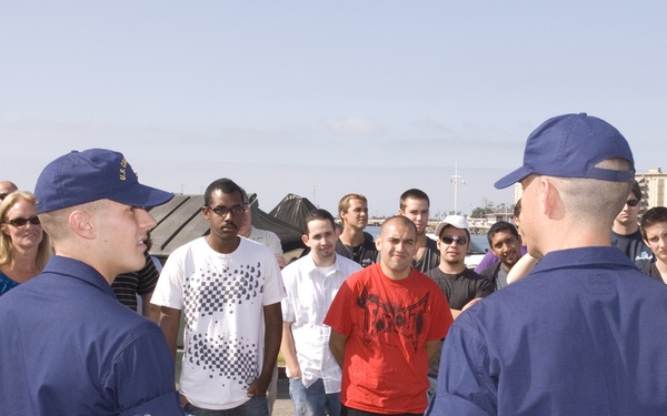 Graduates of Coast Guard basic training talk to recruits