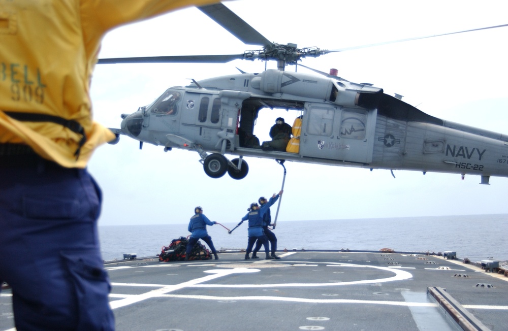 Coast Guard Cutter Campbell works with a Navy HH-60