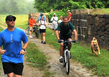 Participants run during the 12th Annual Tom