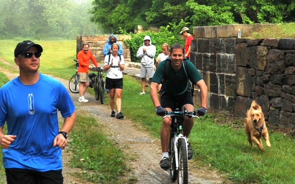 Participants run during the 12th Annual Tom