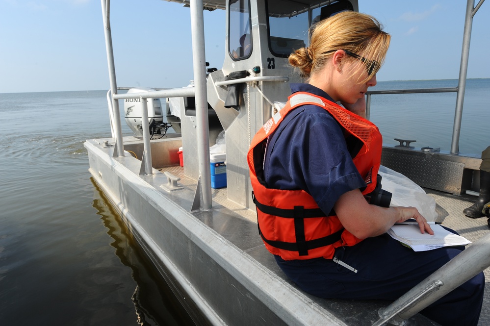 Helo, boom removal in Grand Isle