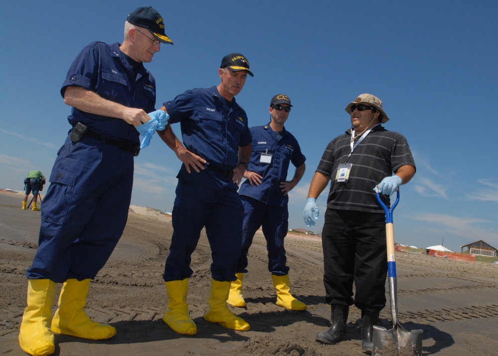 Rear Admirals talking with clean-up crewman
