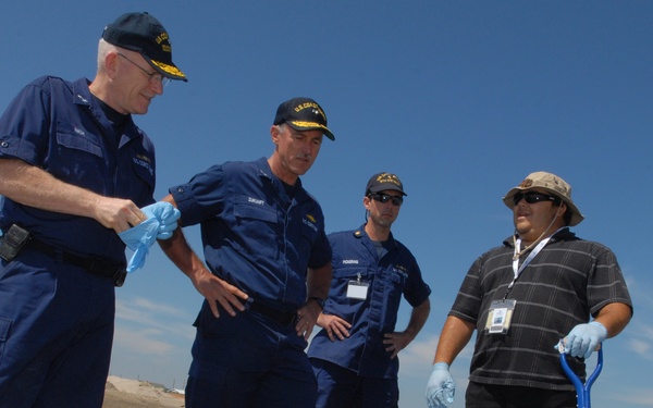 Rear Admirals talking with clean-up crewman
