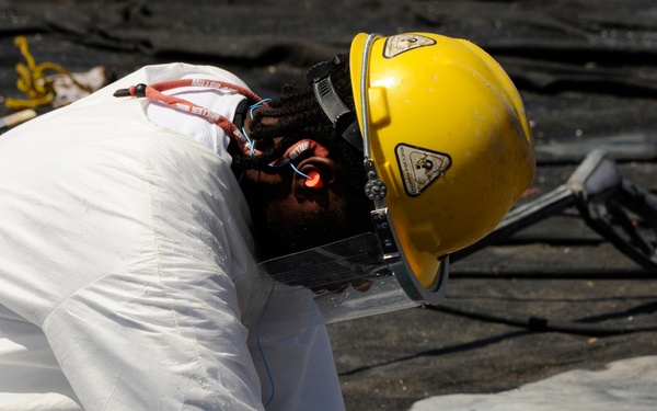 Contract worker on Grand Isle cleaning facility