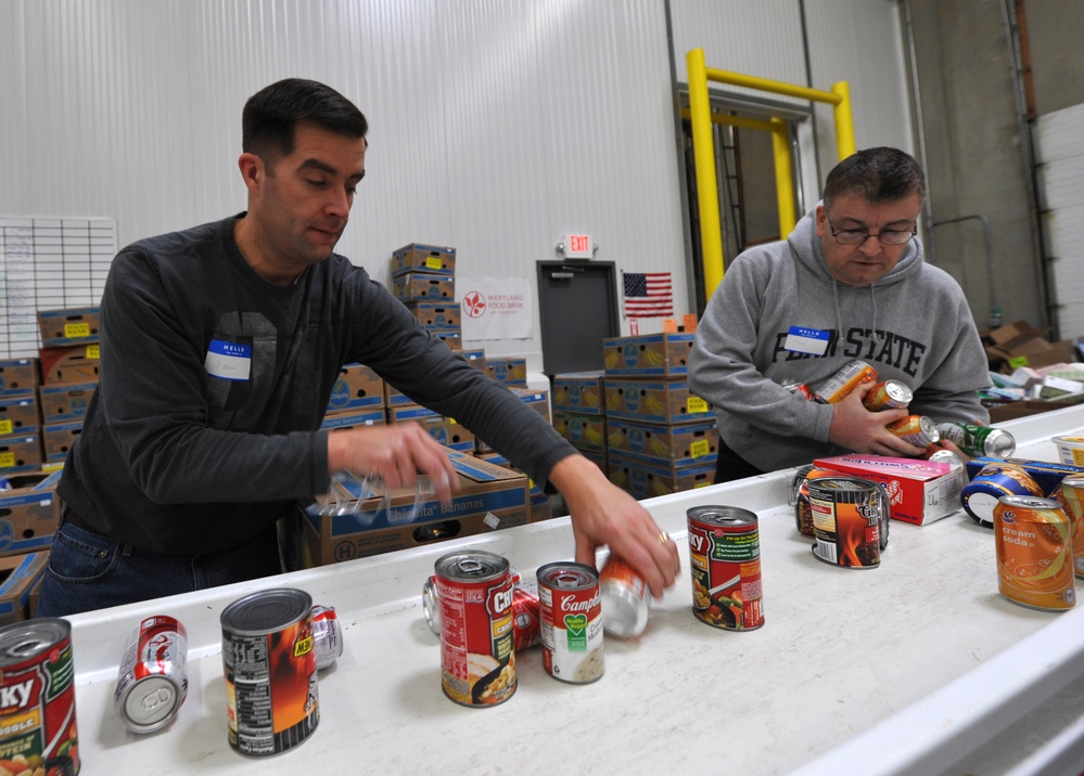Volunteers assist food bank
