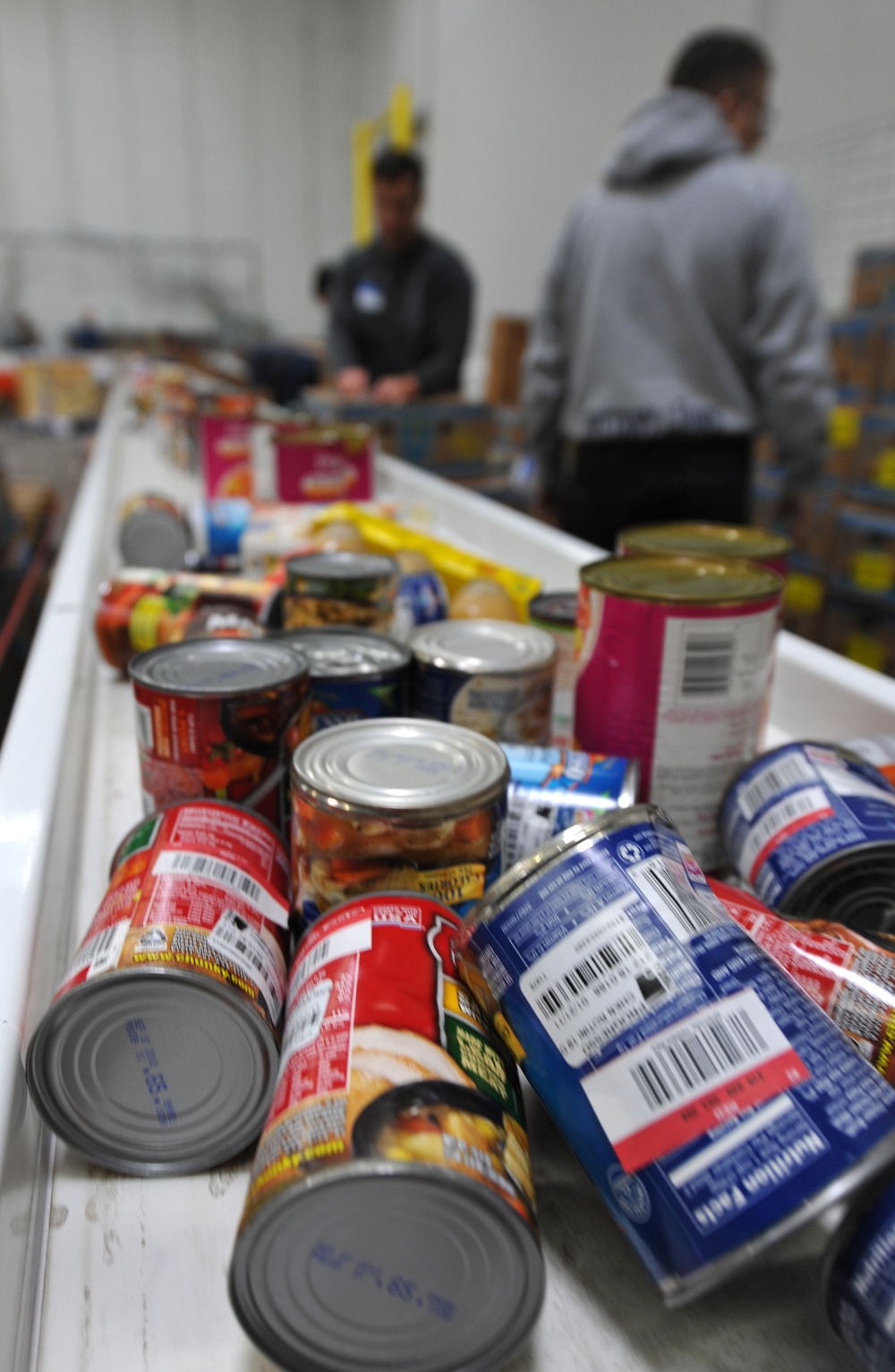 Volunteers assist food bank