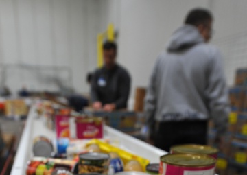 Volunteers assist food bank