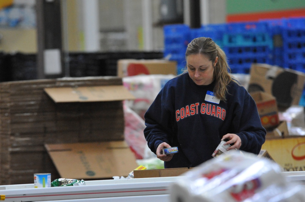 Volunteers assist food bank
