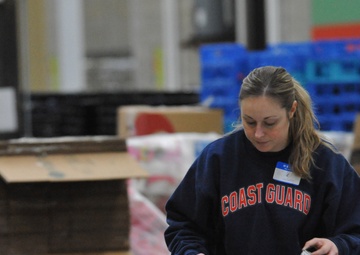 Volunteers assist food bank