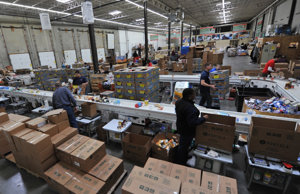 Volunteers assist food bank