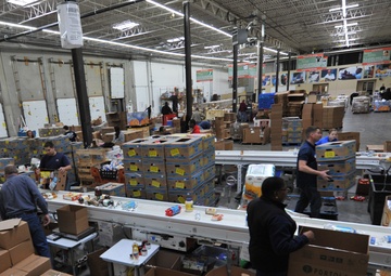 Volunteers assist food bank