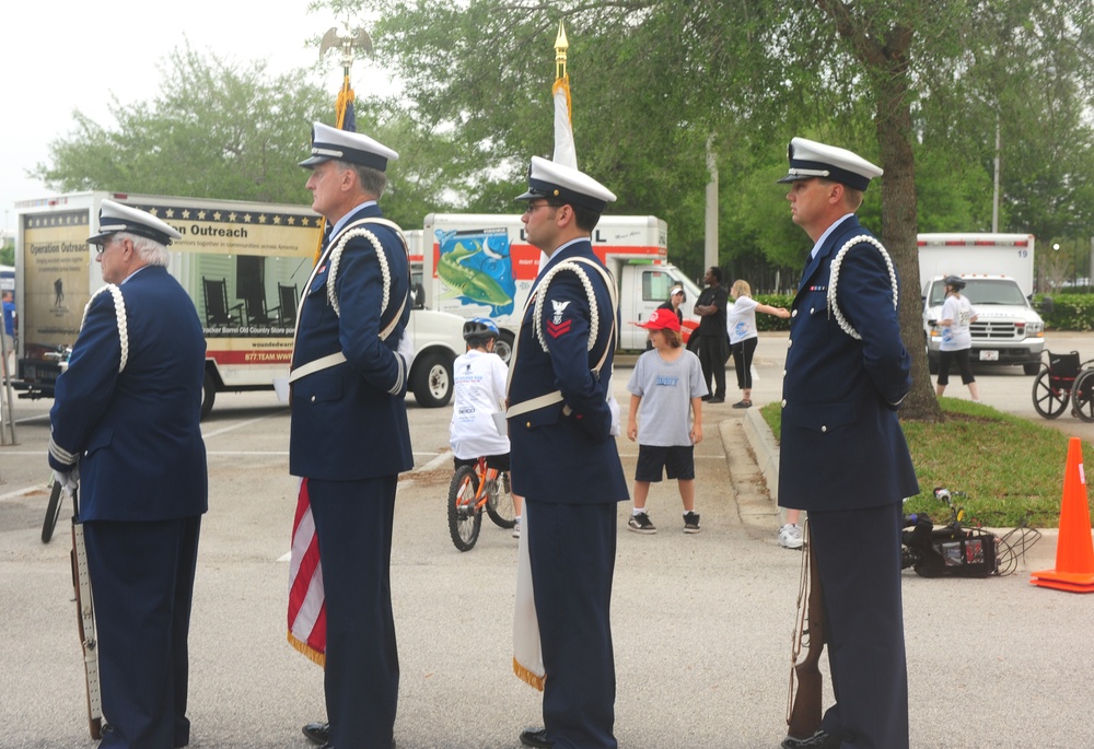 Coast Guard color guard presents colors at the Soldier Ride