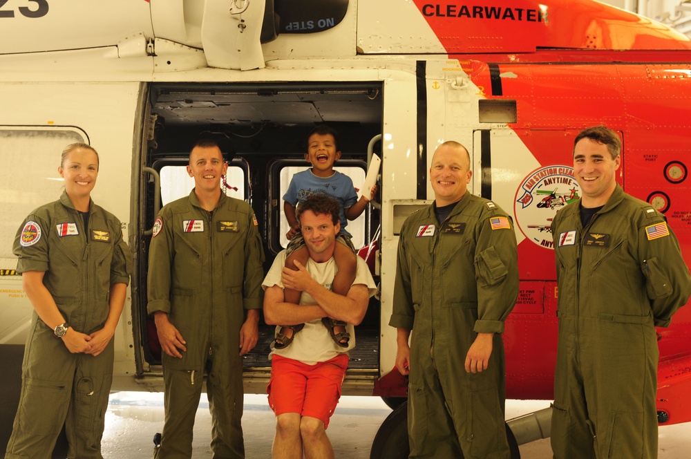 Coast Guard rescue father, son from overturne