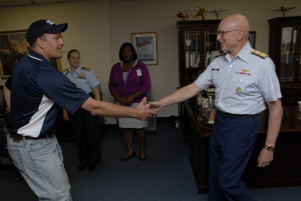 Professional dog sled racer meets with Coast Guard commandant