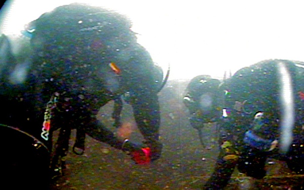 Two Coast Guard Divers measure Minot's Ledge artifact- FOR RELEASE