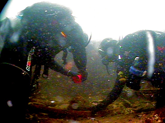 Two Coast Guard Divers measure Minot's Ledge artifact- FOR RELEASE