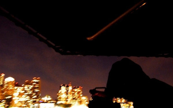 Coast Guard Petty Officer 2nd Class Joshua Scheidell uses an allidade