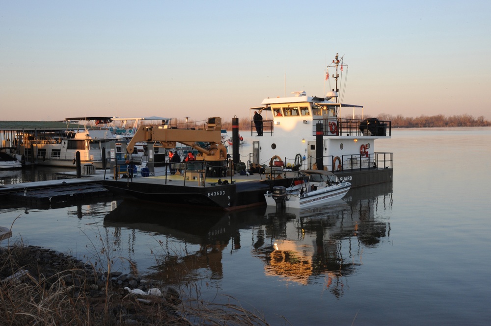 A 64-foot aids to navigation boat moored at Red River South Marina acts as a communication and mooring point