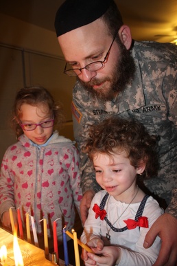 Community welcomes new rabbi to installation, celebrates Hanukkah