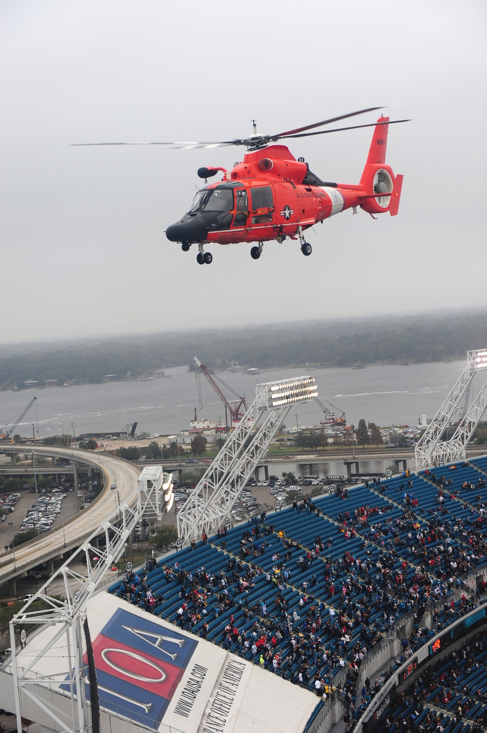 Coast Guard Helicopter Interdiction Tactical Squadron fly over Everbank Stadium