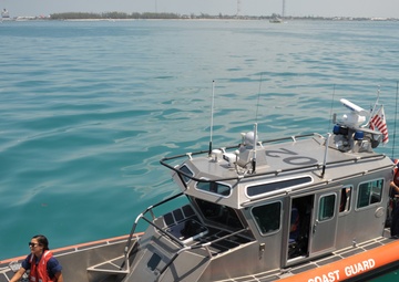 CG boat crew pulls alongside CGC Eagle
