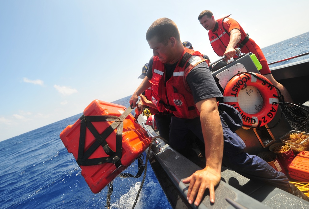 CG boat crew retrieves airdropped part