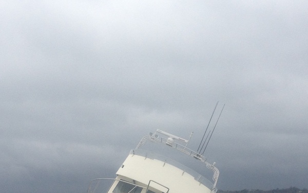 The pleasure craft Bad Penny grounded on a rocky shoreline due to Nor'easter