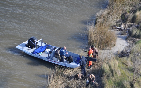 Coast Guard rescues 3 men, dog